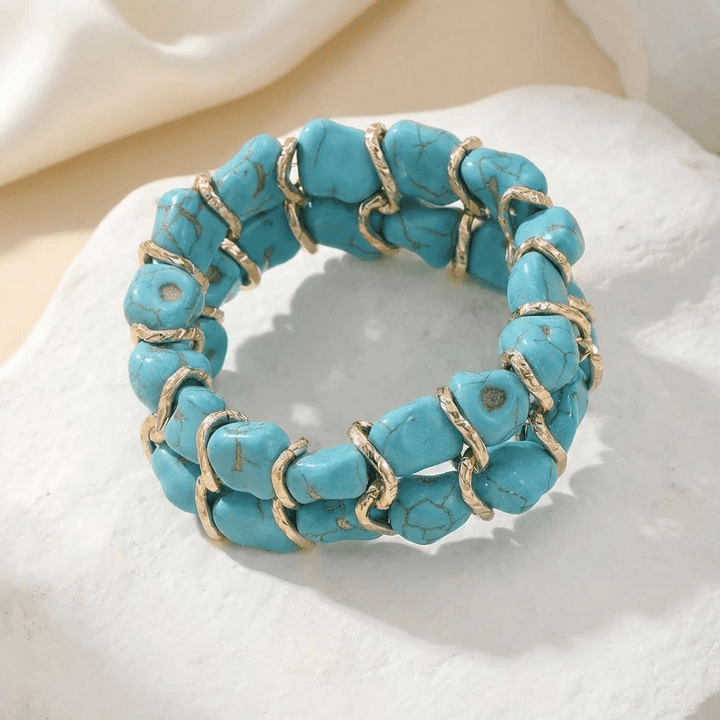 Gouden armband met turkooizen steen